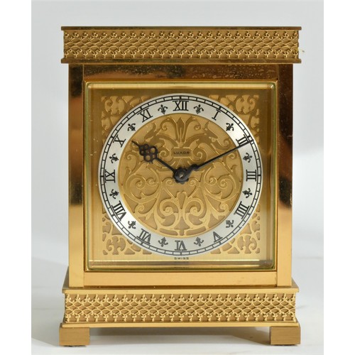 212 - Luxor, a gilt brass mantle clock, the fretwork dial with a silvered chapter ring, the 8 day Swiss mo... 