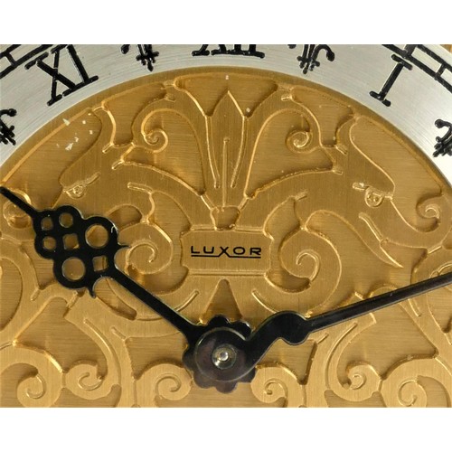 212 - Luxor, a gilt brass mantle clock, the fretwork dial with a silvered chapter ring, the 8 day Swiss mo... 