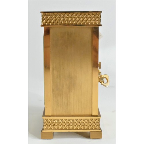 212 - Luxor, a gilt brass mantle clock, the fretwork dial with a silvered chapter ring, the 8 day Swiss mo... 