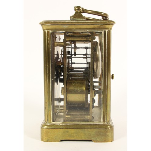 219 - A brass striking carriage clock, white enamel dial, the unsigned movement, numbered 18909, striking ... 