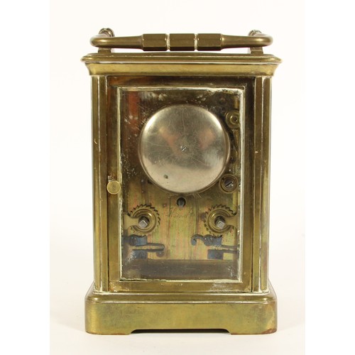 219 - A brass striking carriage clock, white enamel dial, the unsigned movement, numbered 18909, striking ... 