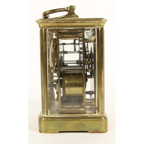 219 - A brass striking carriage clock, white enamel dial, the unsigned movement, numbered 18909, striking ... 