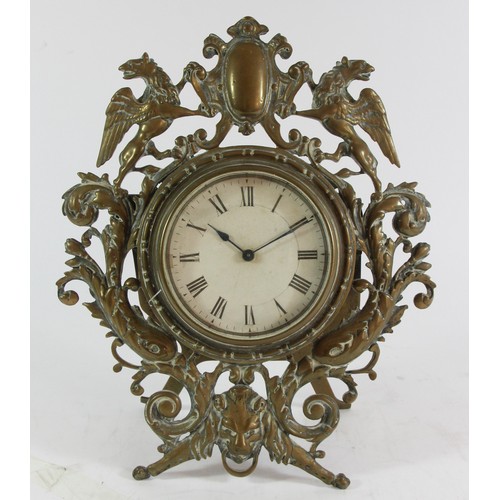 221 - A Victorian cast brass easel mantle clock, the frame with Griffins either side of a shield, floral s... 