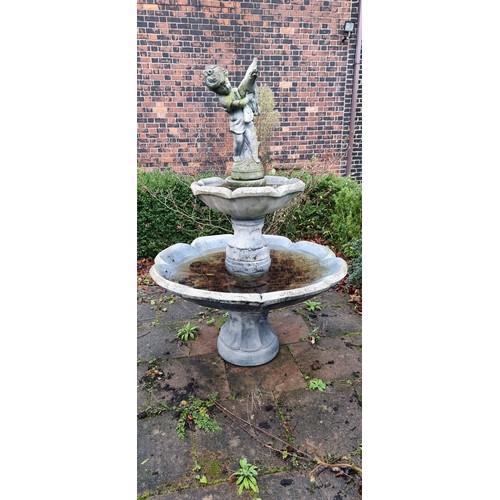 265 - A two tier cast stone effect water fountain, by Hand Studio c.1979, the child holding a dove surmoun... 