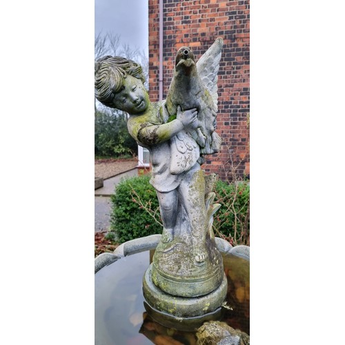 265 - A two tier cast stone effect water fountain, by Hand Studio c.1979, the child holding a dove surmoun... 