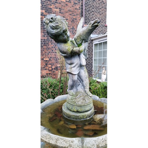 265 - A two tier cast stone effect water fountain, by Hand Studio c.1979, the child holding a dove surmoun... 