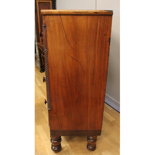 272 - A Victorian bow front mahogany chest of two short over three graduated long drawers, turned pillars,... 