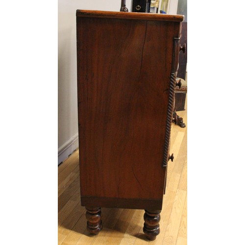 272 - A Victorian bow front mahogany chest of two short over three graduated long drawers, turned pillars,... 