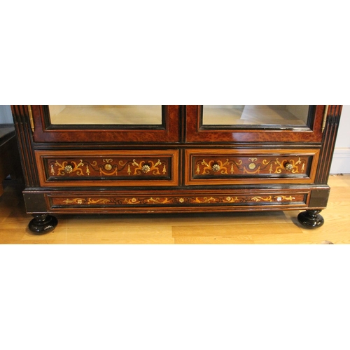 275 - A continental burr walnut and ebonised display cabinet, inlaid floral frieze and two lower drawers, ... 