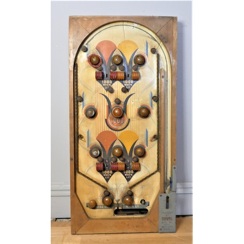 300 - 1000 when lit by Daval Manufacturing Company, USA (1934-1939), C.1935, a hand painted wood pinball b... 