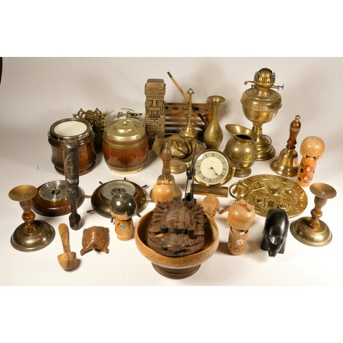 33 - A collection of brass & copper wares, to include candlesticks, chargers, an oil lamp, chamber sticks... 