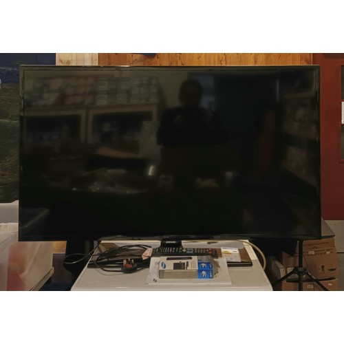 18 - A Samsung 46inch Tv (serial number UE46F5300AK), with remote and manual, together with a Samsung LAN... 