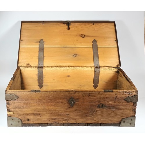 40 - A rustic pine plank traveling trunk, with hinged lid, steel bound corners and edging, cast drop hand... 