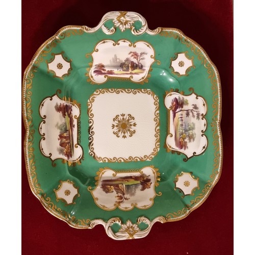 107 - A late 19th century trio, possibly Coalport, decorated with buildings, gilt borders and apple green ... 