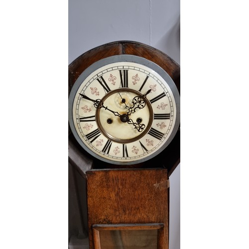 224 - A 19ct century granddaughter longcase clock, the Vienna style dial and movement striking on a gong, ... 