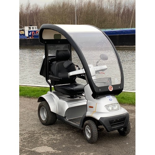 3 - A T.G.A Breezes 4 wheeled mobility scooter complete with rear luggage box and detachable solid canop... 