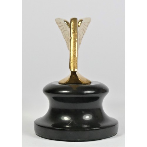 46 - A gold plated car mascot in the form of a winged Bentley mounted on a black base, 9cm.