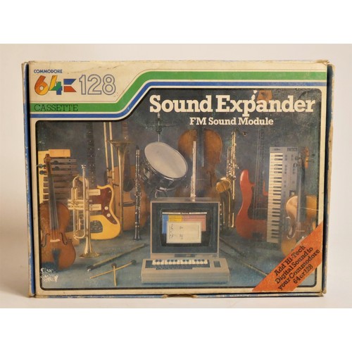 19 - A Commodore 64 sound expander FM sound mudule, AV cabke, casette, manual and original box
