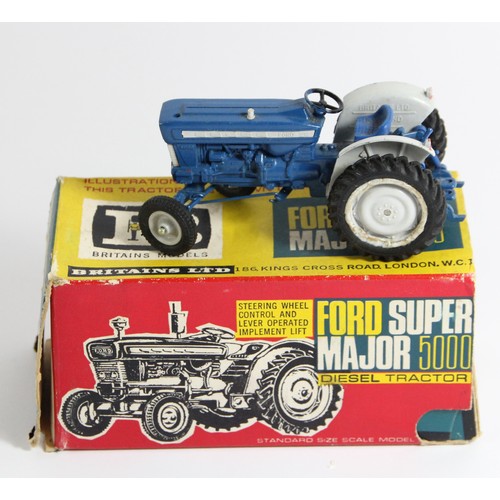 72 - Two Britain's Ford Super Major 5000 diesel tractors, original box, playworn, a Britain's Massey Ferg... 