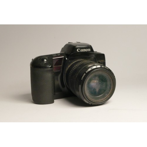 94 - A Canon EOS 10 35mm film camera, with a Canon 28mm-70mm f3.5-f4.5 II lens, a Canon 100mm-300mm f4.5-... 