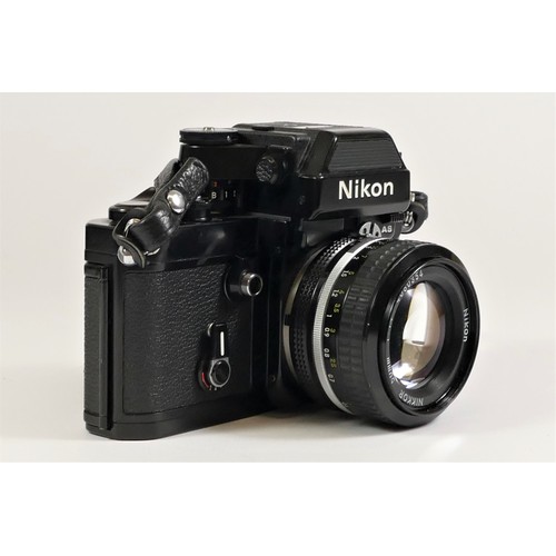 116 - A Nikon F2 (7760927) SLR camera, black, with Photomic AS viewfinder, cased, with a Nikon 50mm f1.4 l... 