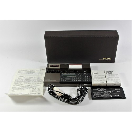 126 - A Sharp PC-1248 Pocket Computer (serial No 77019547, a Sharp CE-125 printer and Microcassette record... 