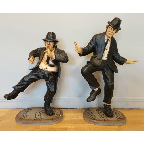 167 - A pair of resin figures, The Blues Brothers, hollow cold cast resin, wooden bases, decorated with mu... 