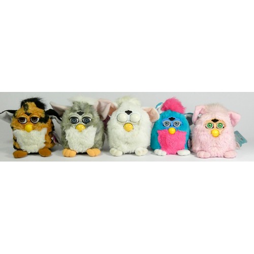 173 - Three Classic Furbies robotic toys, c.1998, all with material tag (two with card tag), together with... 