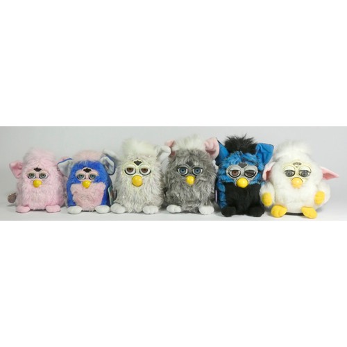 174 - Three Classic Furbies robotic toys, c.1998, all with material tag (two with card tag and purple plas... 