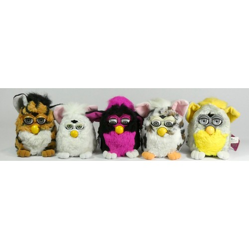 177 - Four Classic Furbies robotic toys, c.1998, all with material tag (two with card tag and purple plast... 