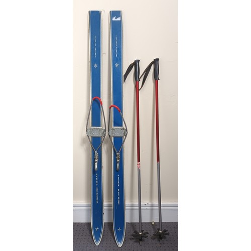 192 - A pair of Tyrol-Record junior skis, together with a pair of ski poles