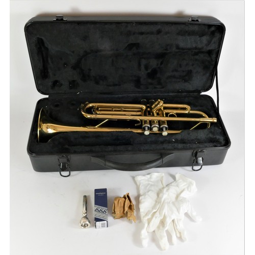 204 - A Jazzo trumpet with silver plated mouth piece, mother of pearl inlay buttons, white cotton gloves a... 