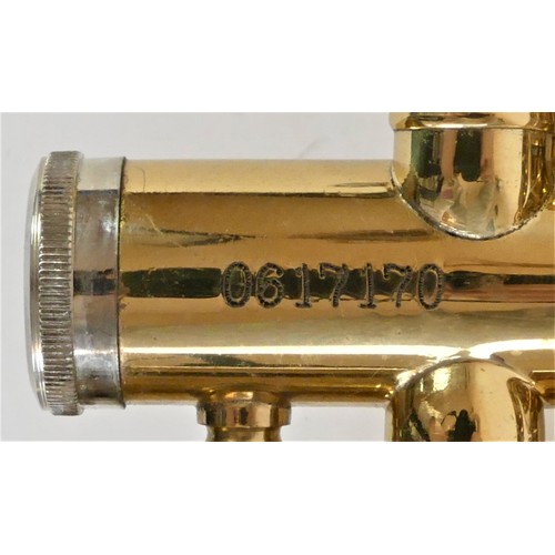 204 - A Jazzo trumpet with silver plated mouth piece, mother of pearl inlay buttons, white cotton gloves a... 