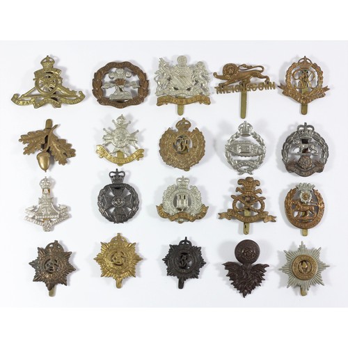 270 - A collection of 20 military cap badges, to include the Tank Regiment , Manchester Regiment and Notts... 