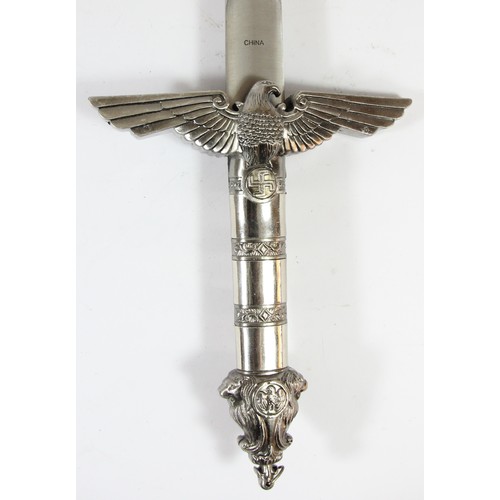 309 - A reproduction Nazi dagger, the blade stamped China, blade length41cm
This bladed product is not for... 