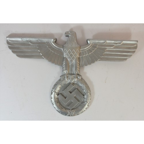 316 - A reproduction Nazi silvered metal eagle, wing span 40cm