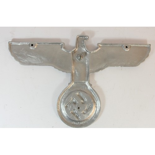 316 - A reproduction Nazi silvered metal eagle, wing span 40cm