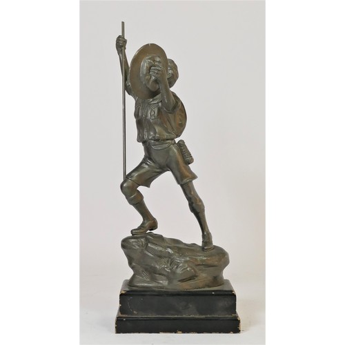 322 - A mid 20th century spelter Scouts trophy / figurine of a young boy scout reaching the peak of a moun... 