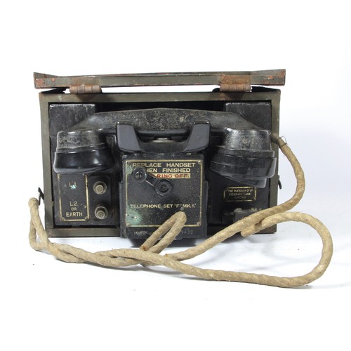 324 - WWII British Army field telephone set F MKII, nr faded, with broad arrow mark, housed in a timber bo... 