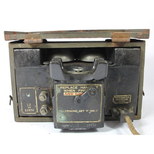 324 - WWII British Army field telephone set F MKII, nr faded, with broad arrow mark, housed in a timber bo... 