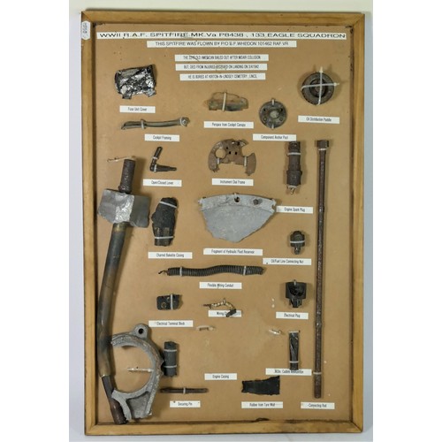 325 - WWII Spitfire Mk Va memorabilia, mounted on a board, stating that the bits were collected from a cra... 