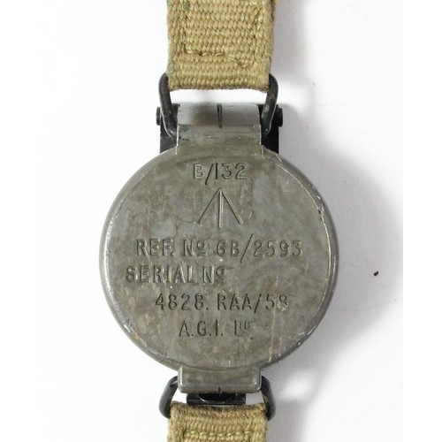 328 - A British Army wrist compass, the hinged cover stamped B/132, Broad Arrow, Ref No 6B/2593, serial no... 