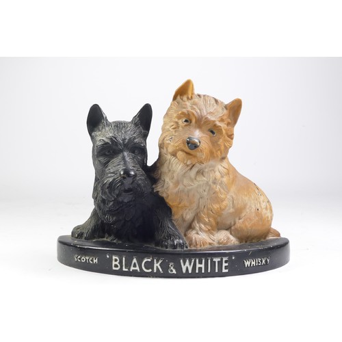 212 - A Scotch Whiskey 'Black & White' advertisement figure, flatback, rubber, 20cm x 26cm