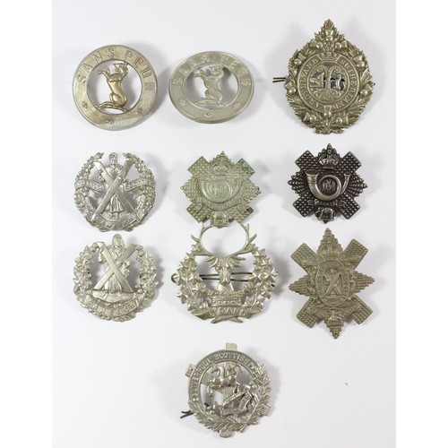 272 - A collection of 10 Scottish military cap badges, to include the Black Watch and Highland Light Infan... 