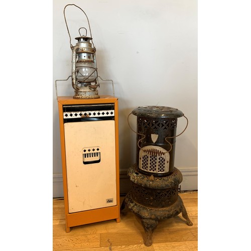 A Valor paraffin heater, 56m tall, together with another Valor 106-R  paraffin heater, together with