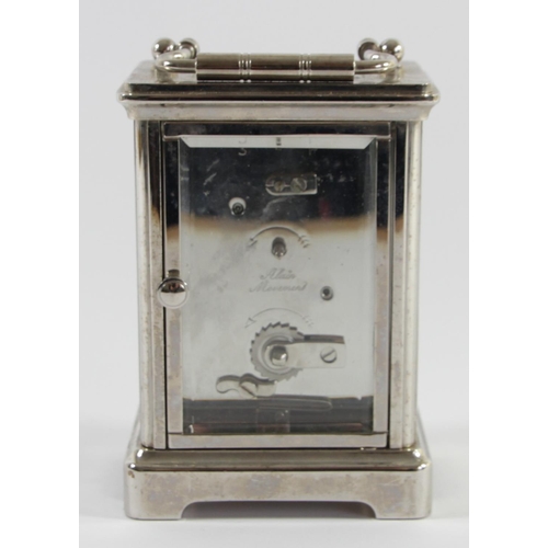 A Woodford Obis 8 day carriage clock chrome plated solid brass casing with  beveled edge glass panels