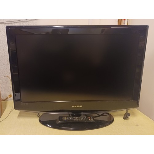 7 - A Samsung 32 inch TV (model LE32R88BD), with power and AV cables, and remote.