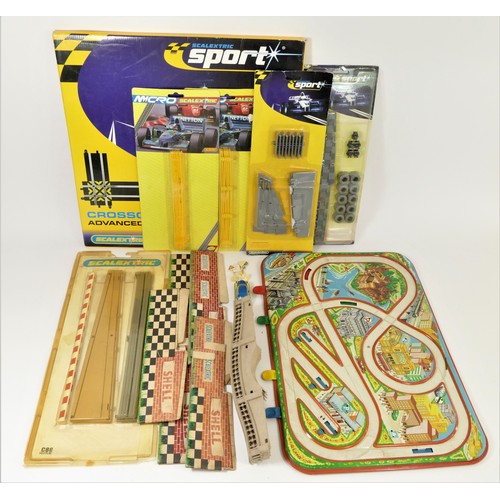 27 - A collection of Scalextric track and track side decoration, together with a tin plate traffic light ... 