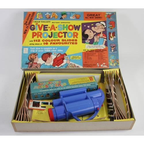 51 - A Chad Valley battery operated Give A Show Projector, including 35mm slides from franchises such as ... 