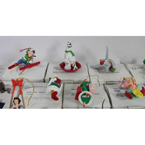 53 - A collection of twenty eight Grolier Disney Christmas decorations, boxed, including Figaro (127), Sc... 